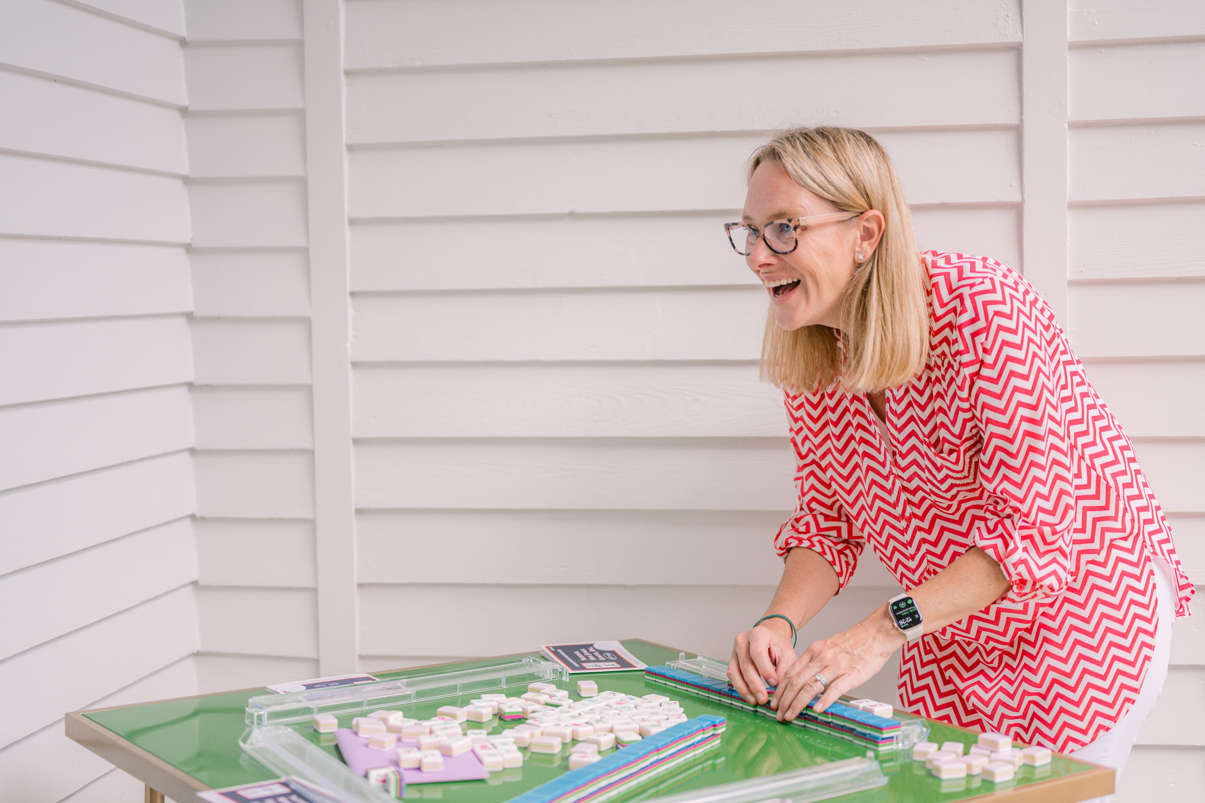 Heather smiling while playing Mahjong